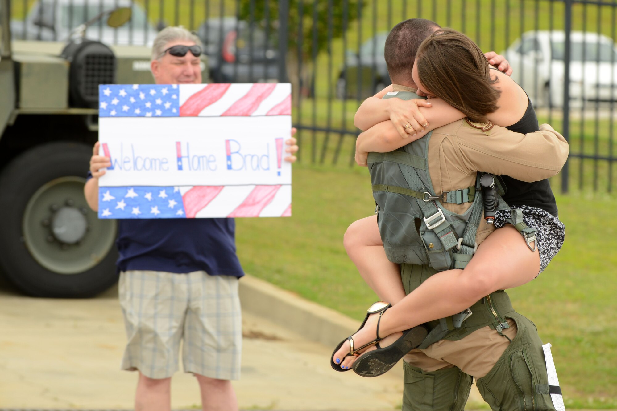 A U.S. Airman assigned to the 79th Fighter Squadron (FS) hugs a family member after returning to Shaw Air Force Base, S.C., May 4, 2017. The 79th FS is one of three 20th Fighter Wing F-16CM Fighting Falcon squadrons which supply suppression of enemy air defenses and combat-ready airpower. (U.S. Air Force Airman 1st Class Kathryn R.C. Reaves)