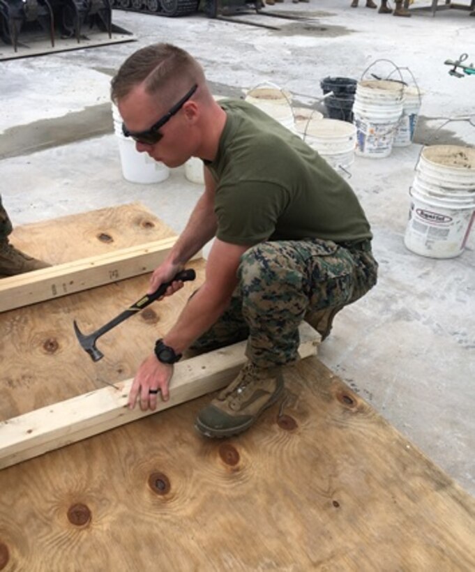 On May 1, 2017 Second Lieutenant Andrew Shrader, a Marine attached to Combat Engineer Officer course 4-17 (CEO 4-17); nails 2” x 4” boards together to create a form used to facilitate concrete pouring. CEO students learn how to calculate concrete production during this course at Marine Corps Engineer School in Camp Lejeune, N.C.
