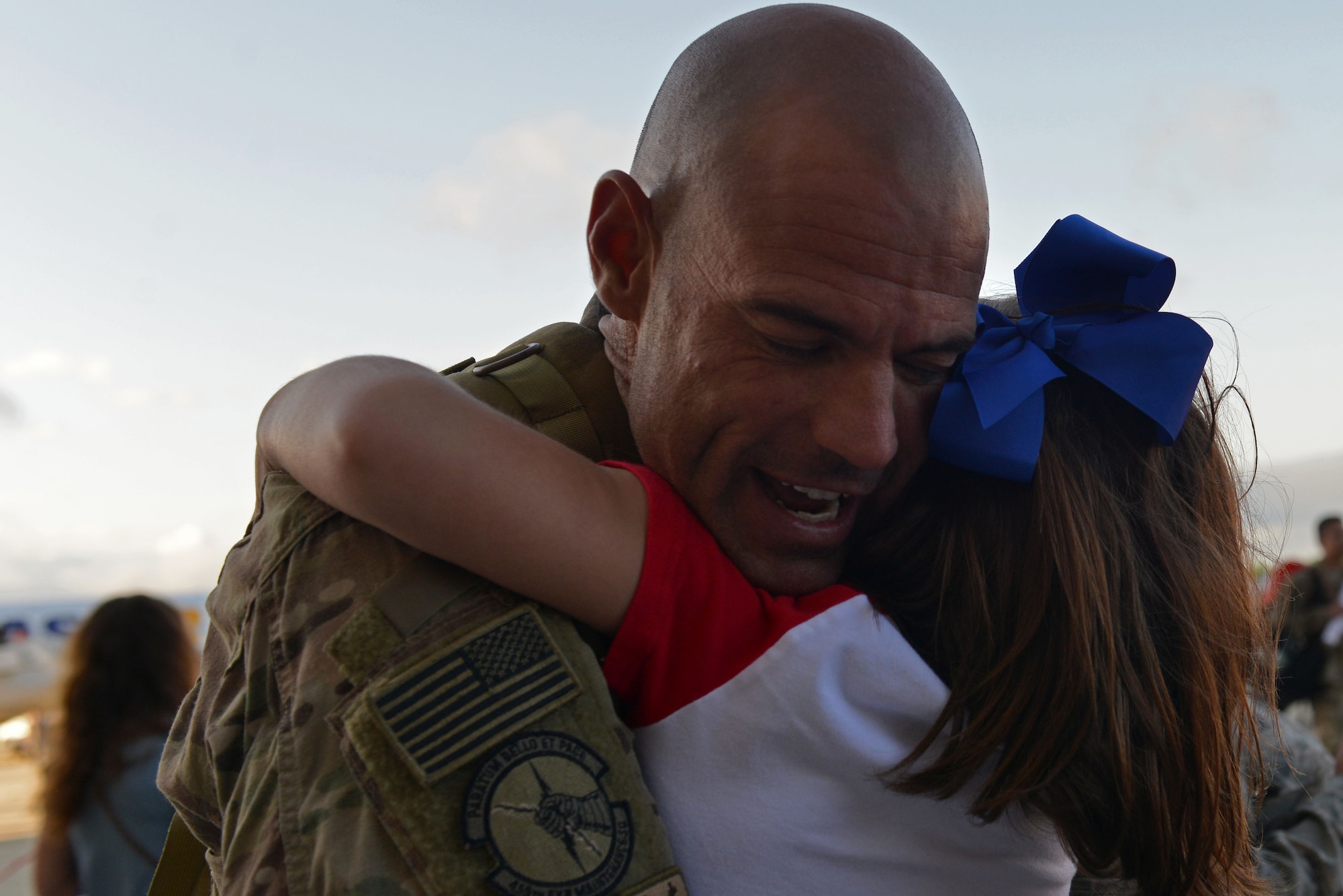 A U.S. Airman assigned to the 20th Fighter Wing hugs his child after returning to Shaw Air Force Base, S.C., May 5, 2017. Airmen returned after a six-month deployment to the United States Central Command area of responsibility. (U.S. Air Force photo by Airman 1st Class Destinee Sweeney)