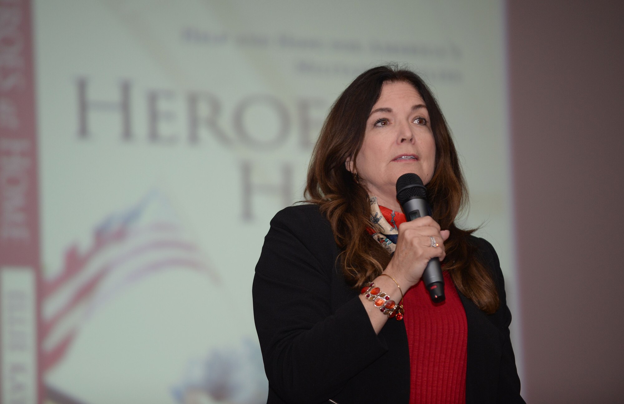 Ellie Kay, a best-selling author of 15 books, speaks to Airmen and their families about financial education in the base theatre on RAF Mildenhall, England, May 2, 2017. Kay visited RAF Mildenhall with her “Heroes at Home” tour in order to assist military families with financial management and planning. (U.S. Air Force photo by Airman 1st Class Luke Milano)
