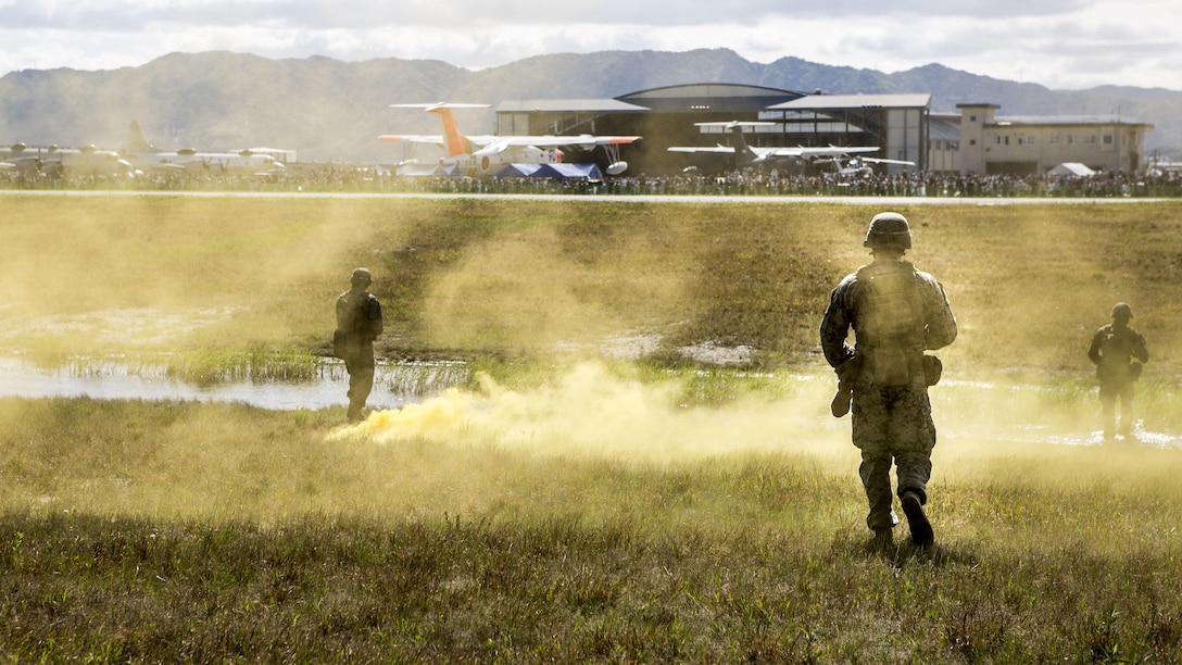 U.S. Marine Corps MV-22B Ospreys and Marines with Headquarters and Support Company, 3rd Battalion, 8th Marine Regiment, 2nd Marine Division conduct a Marine Air-Ground Task Force demonstration during the 41st Japan Maritime Self-Defense Force – Marine Corps Air Station Iwakuni Friendship Day at MCAS Iwakuni, Japan, May 5, 2017. Since 1973, MCAS Iwakuni has held a single-day air show designed to foster positive relationships and offer an elevating experience that displays the communal support between the U.S. and Japan. The air show also encompassed various U.S. and Japanese static aircraft displays, aerial performances and demonstrations, food and entertainment.