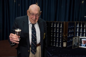 DAYTON, Ohio -- Lt. Col. (Ret.) Richard E. Cole, the sole surviving member of the Doolittle Tokyo Raiders toasts the fallen Raiders in a private ceremony at the National Museum of the U.S. Air Force on April 18, 2017. (U.S. Air Force photo by Ken LaRock) 