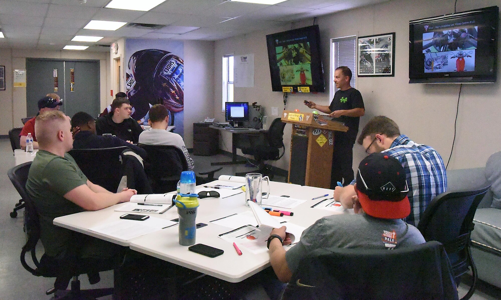 Staff Sgt. Kristian Jaggers, Motorcycle Safety Foundation Rider Coach, explains the basic instruments of the motorcycle during a basic rider course classroom discussion April 26. The first day of the three-day course is classroom instruction, while the final two days are practical application. The course is free and required by the Air Force for anyone wishing to ride on base. To sign up for a Rider Course, go to https://sites.google.com/site/kafbriders. 