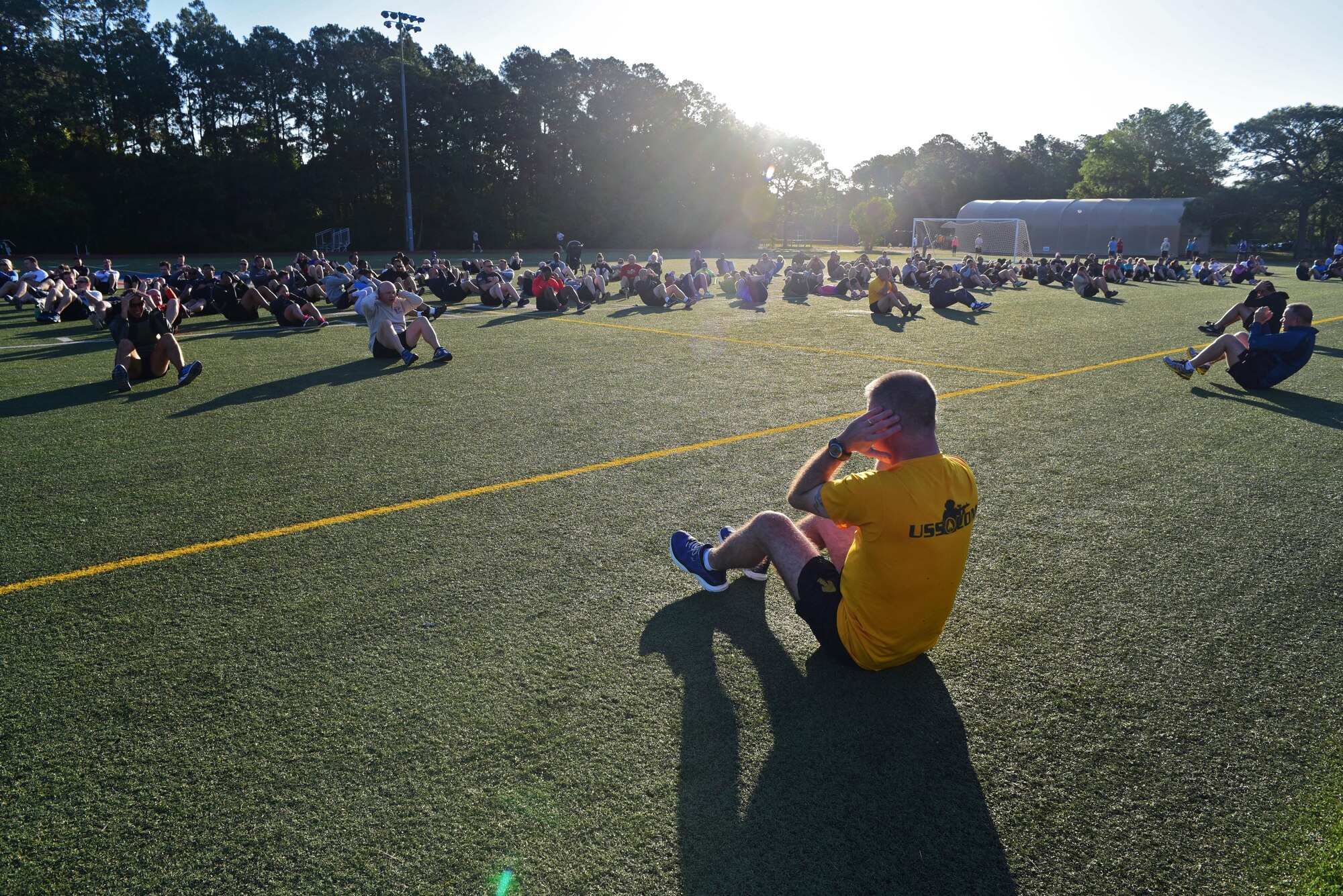 Headquarters Air Force Special Operations Command Air Commandos warm up at Hurlburt Field, Fla., May 5, 2017. Chief Master Sgt. Greg Smith, AFSOC command chief, led the staff in the 5K run. (U.S. Air Force photo/Staff Sgt. Melanie Holochwost)