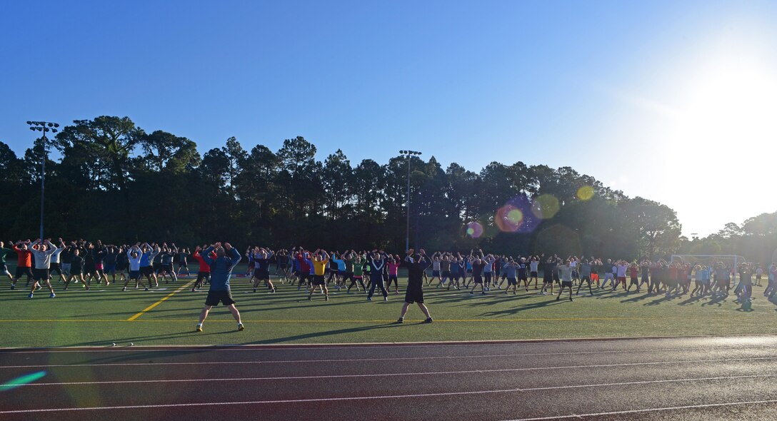 The Headquarters Air Force Special Operations Command staff warms up for a 5K run at Hurlburt Field, Fla., May 5, 2017. These Air Commandos meet once a month to work out together. (U.S. Air Force photo/Staff Sgt. Melanie Holochwost)