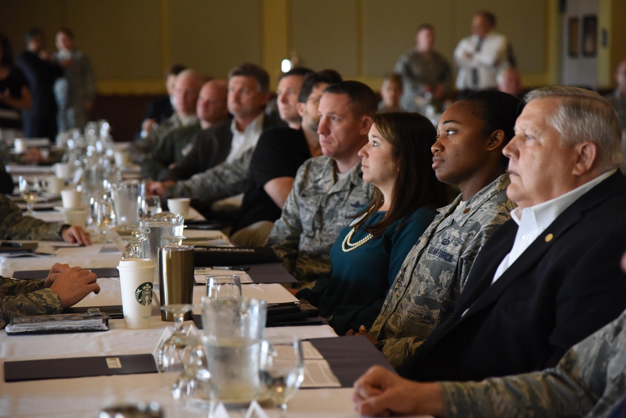 Military and civic leaders watch a promotional video during the Air Force Community Partnership Program kick-off meeting at the Bay Breeze Event Center May 3, 2017, on Keesler Air Force Base, Miss. The program is designed to leverage military and local community capabilities and resources to achieve mutual value and benefit in support of the Air Force and its business partners. (U.S. Air Force photo by Kemberly Groue)