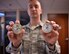 Senior Airman Travis J. Biggers displays the two challenge coins he received from 932nd Airlift Wing leadership May 5, 2017, Scott Air Force Base, Illinois, for his accomplishments while attending the Chief Master Sergeant of the Air Force Bud Andrews Airman Leadership School Scott Air Force Base.   (U.S. Air Force photo by Christopher Parr)
