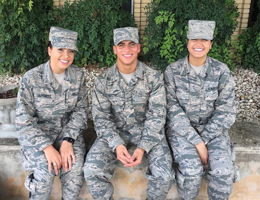 Pictured are the Harchaoui triplets (from left): Myriam, 436th Supply Chain Operations Squadron at Scott Air Force Base, Ill.; Rabah, 56th Security Forces Squadron at Luke AFB, Ariz.; and Warda, 60th Medical Operations Squadron at Travis AFB, Calif. All three were born in Algeria before immigrating to the United States, and are Airmen serving in today’s Air Force. (Courtesy photo)