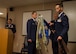 (from left) Lt. Col. John Robinson, 315th Operations Group commander, watches Maj. Hamilton Underwood, the units commander, unravel the 4th CCTS colors during a unit reactivation and assumption of command ceremony at Joint Base Charleston, S.C., May 5. The 4th CTCS, which was formally assigned to March Air Reserve Base in Riverside, Calif., deactivated in July 2015, but was reactivated and relocated to the 315 AW due to mission need. (U.S.Air Force Photo by Michael Dukes)