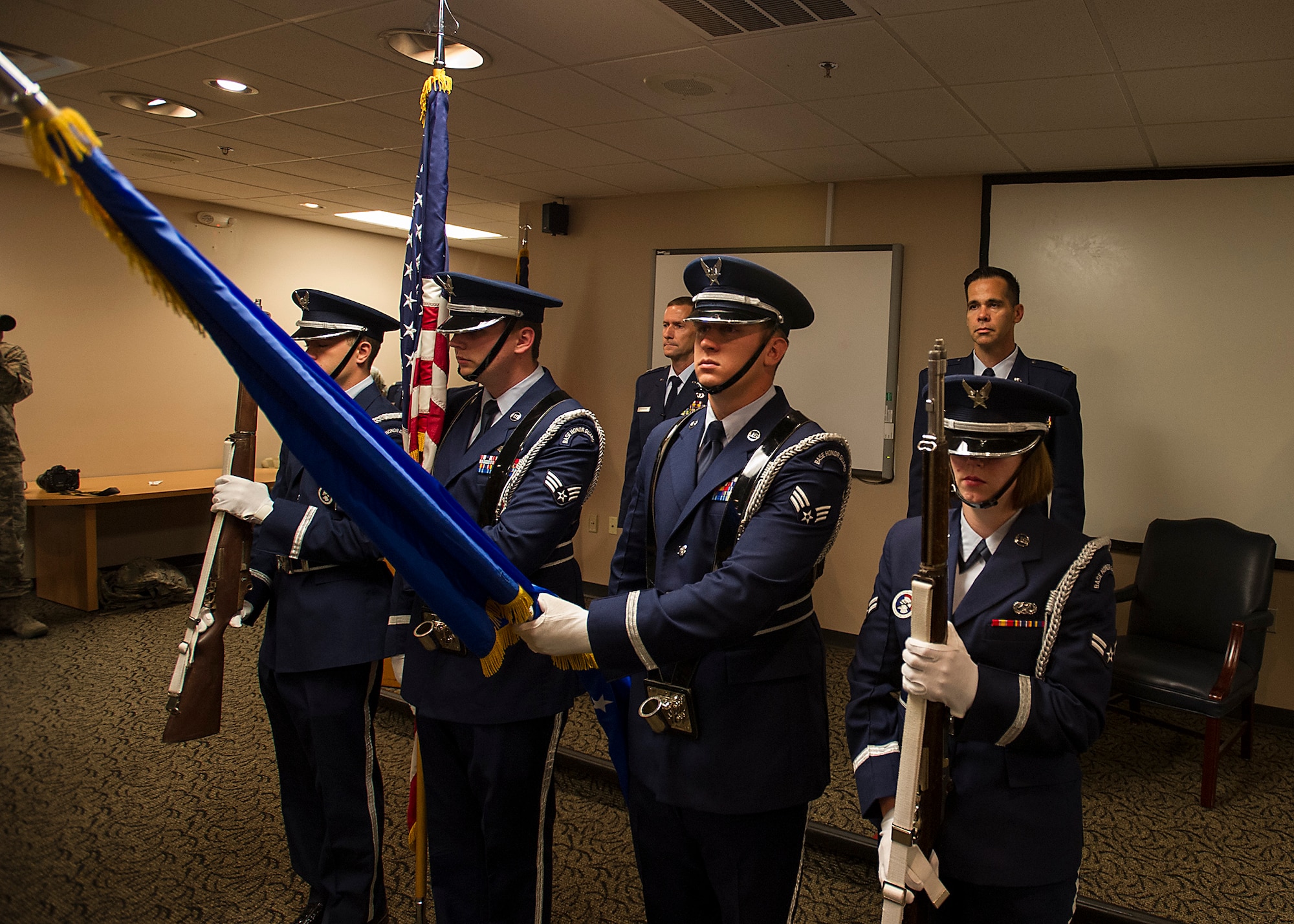 The colors are posted while the National Anthem is sung at a reactivation & assumption of command ceremony for the 4th Combat Camera Squadron at Joint Base Charleston, S.C., May 5. The 4th CTCS, which was formally assigned to March Air Reserve Base in Riverside, Calif., deactivated in July 2015, but was reactivated and relocated to the 315 AW due to mission need. (U.S.Air Force Photo by Michael Dukes)