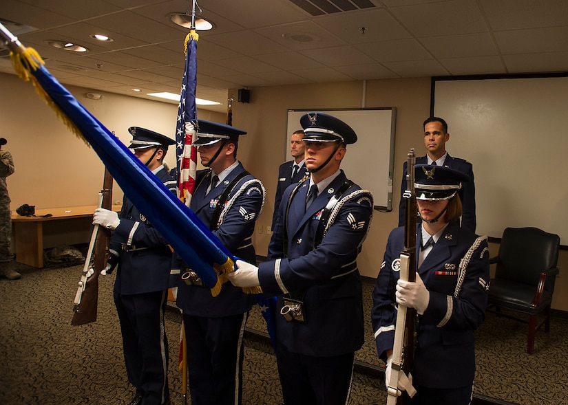 The colors are posted while the National Anthem is sung at a reactivation & assumption of command ceremony for the 4th Combat Camera Squadron at Joint Base Charleston, S.C., May 5. The 4th CTCS, which was formally assigned to March Air Reserve Base in Riverside, Calif., deactivated in July 2015, but was reactivated and relocated to the 315 AW due to mission need. (U.S.Air Force Photo by Michael Dukes)