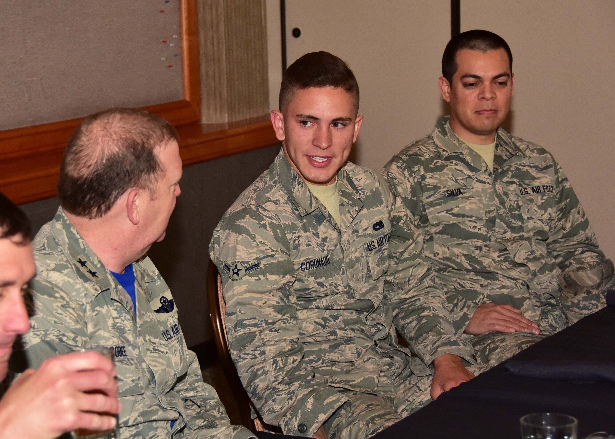 Airman Gabriel Coronado, 944th Fighter Wing Det. 1 munitions, talks with Maj. Gen. Richard Scobee, 10th Air Force commander, Apr. 14 during a luncheon held at Falcon Dunes golf course, Luke Air Force Base, Ariz. (U.S. Air Force photo by Tech. Sgt. Louis Vega Jr.)