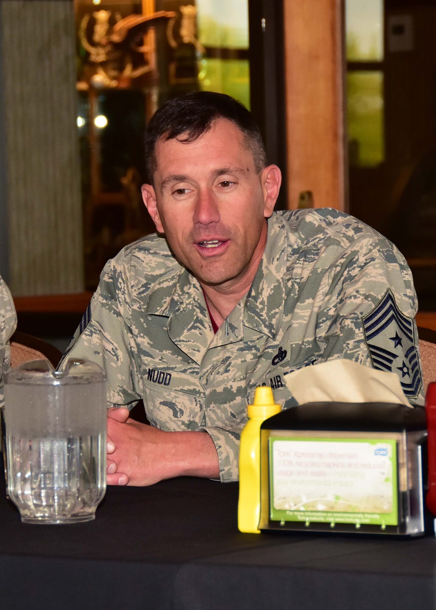 Chief Master Sgt. James Nudd, 944th Fighter Wing interim command chief, talks with Airmen from the 944 FW Apr. 14 during a luncheon held at the Falcon Dunes golf course, Luke Air Force Base, Ariz. (U.S. Air Force photo by Tech. Sgt. Louis Vega Jr.)