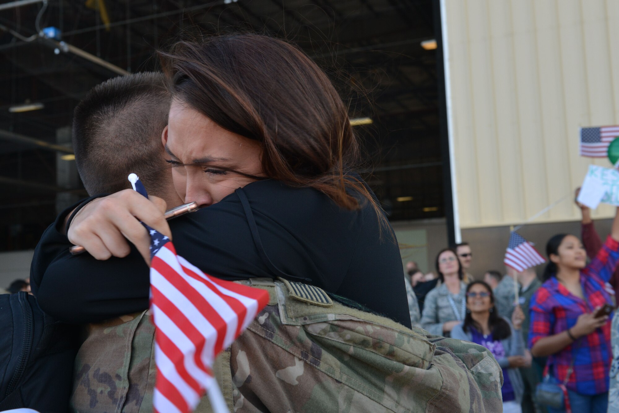 A U.S. Airman assigned to the 20th Fighter Wing hugs a family member after returning to Shaw Air Force Base, S.C., May 5, 2017. Airmen returned after a six-month deployment to the United States Central Command area of responsibility. (U.S. Air Force photo by Airman 1st Class Destinee Sweeney)