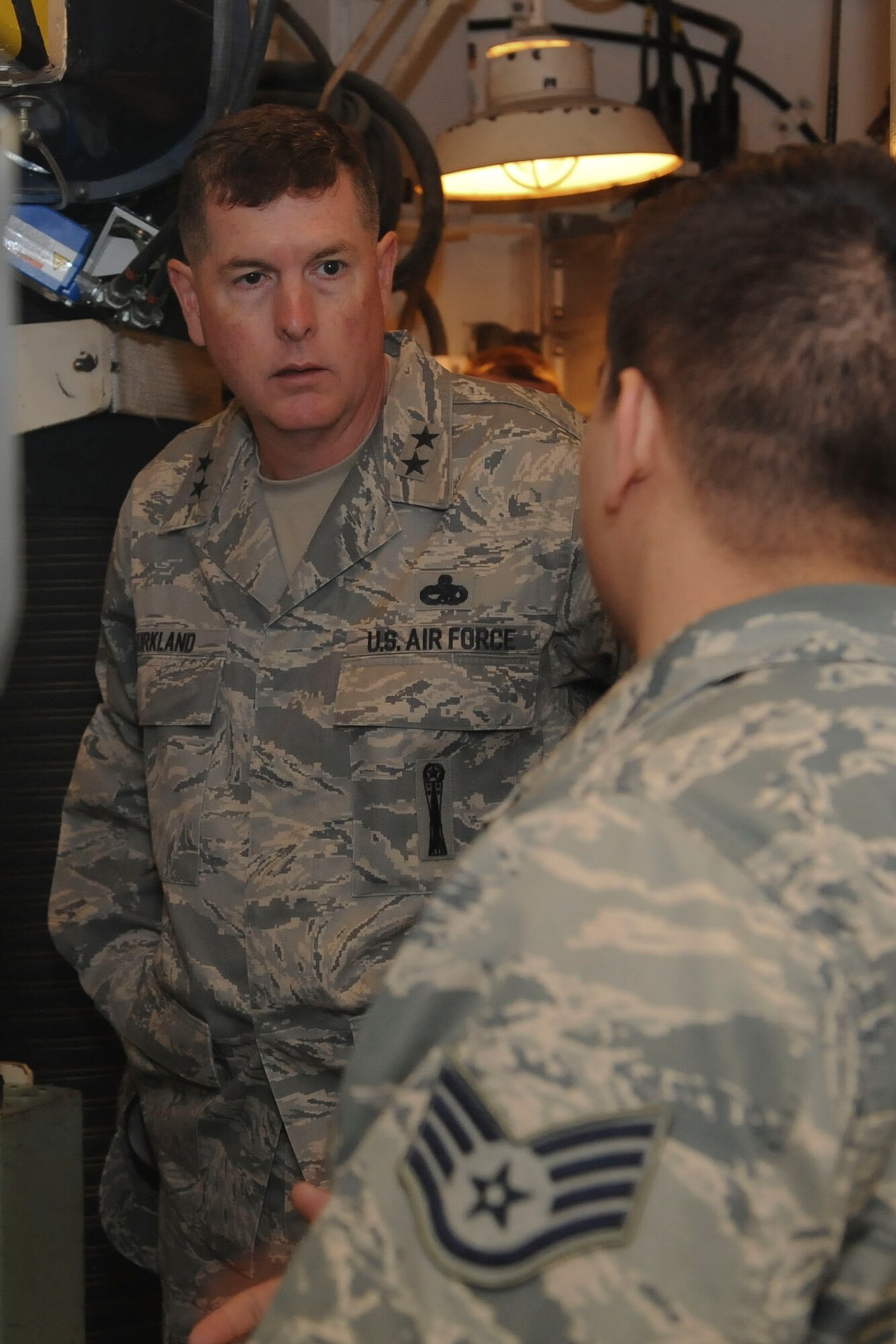 Maj. Gen. Gene Kirkland, Air Force Material Command director of logistics, civil engineering and force protection, talks with an Airman at Minot Air Force Base, N.D., Apr. 28, 2017. Kirkland visited to discuss logistics 5th Bomb Wing and 91st Missile Wing Airmen and speak at the 91st Maintenance Group Maintenance Professional of the Year banquet. (U.S. Air Force photo/Airman 1st Class Jessica Weissman)