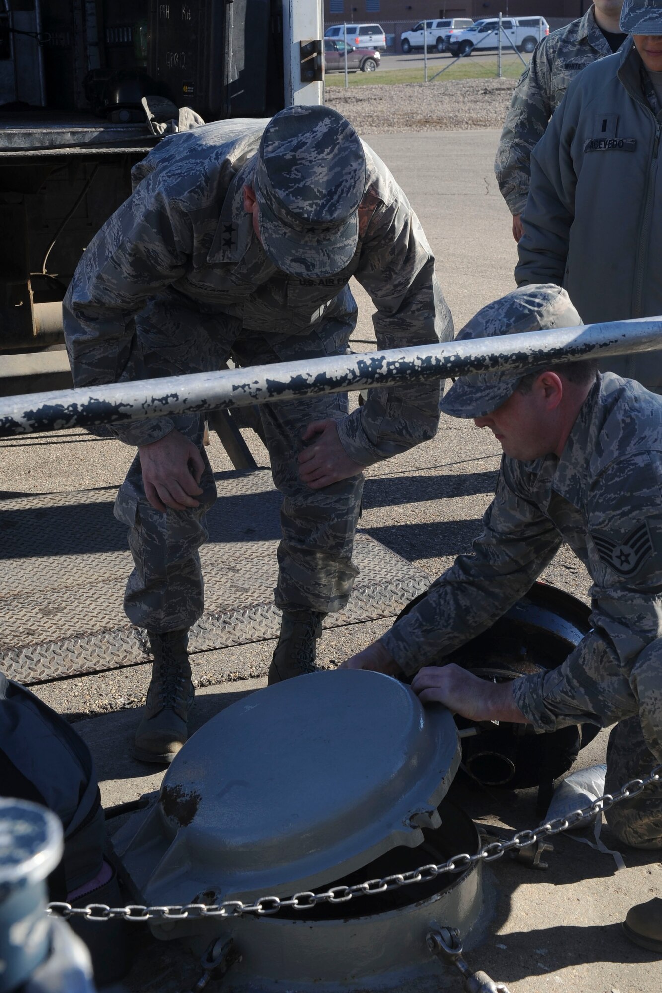 Staff Sgt. Isaac Purseglove, 91st Missile Maintenance Squadron electro-mechanical team supervisor, describes a security pit to Maj. Gen. Gene Kirkland, Air Force Material Command director of logistics, civil engineering and force protection, at Minot Air Force Base, N.D., Apr. 28, 2017. Kirkland visited to discuss logistics 5th Bomb Wing and 91st Missile Wing Airmen and speak at the 91st Maintenance Group Maintenance Professional of the Year banquet. (U.S. Air Force photo/Airman 1st Class Jessica Weissman)