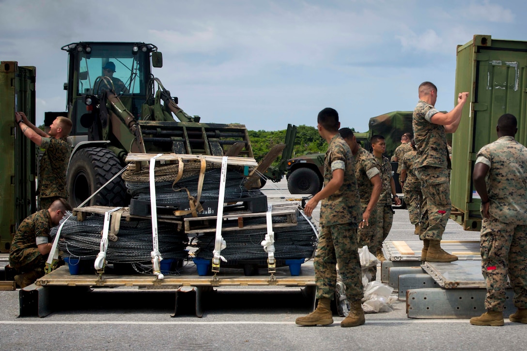 Marines place equipment and gear on pallets during an Alert Contingency Marine Air-Ground Task Force drill at Kadena Air Base in Okinawa, Japan, May 5, 2017. Marine Corps photo by Lance Cpl. Juan C. Bustos