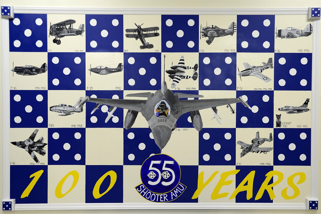 A hand painted mural depicts aircraft flown in the past 100 years of service for the 55th Fighter Squadron and 55th Aircraft Maintenance Unit at Shaw Air Force Base, S.C., April 28, 2017. After approximately 55 hours spent painting, the mural was completed April 28 with the addition of a protective coating and wooden border. (U.S. Air Force photo by Senior Airman Kelsey Tucker)
