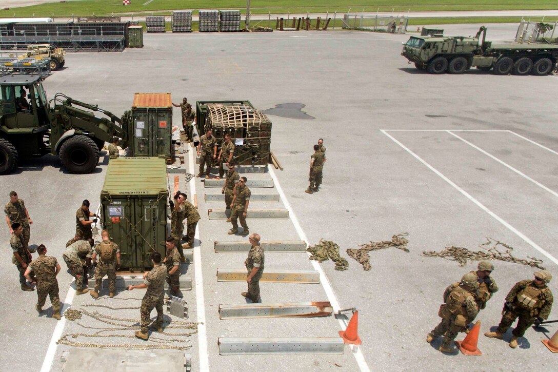 Marines place equipment and gear on pallets during an Alert Contingency Marine Air-Ground Task Force drill at Kadena Air Base in Okinawa, Japan, May 5, 2017. Marine Corps photo by Sgt. Scott P. Smolinksi