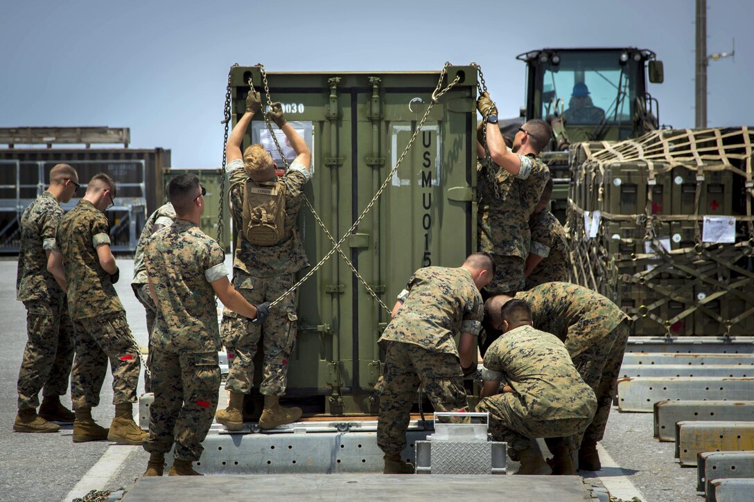 Marines chain down equipment Alert Contingency Marine Air-Ground Task Force drill at Kadena Air Base in Okinawa, Japan, May 5, 2017. Marine Corps photo by Lance Cpl. Juan C. Bustos