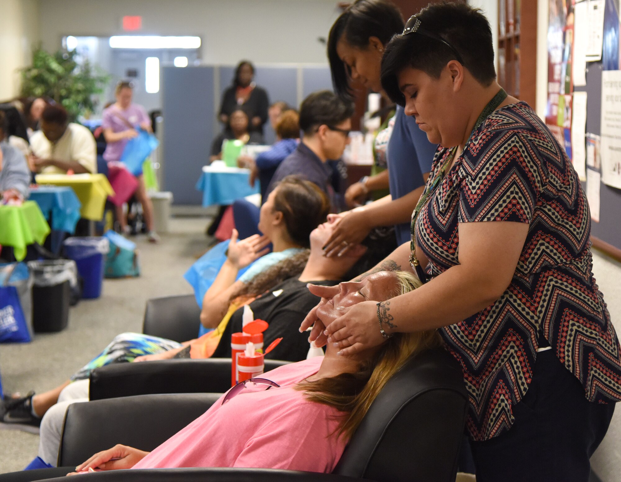 Students from Virginia College provide face massages to Keesler spouses during Pamper Me Day at the Sablich Center May 4, 2017, on Keesler Air Force Base, Miss. Keesler’s Airman and Family Readiness Center has hosted the event for the past 13 years, offering spouses free manicures, make-up styling tips and information and business booths. (U.S. Air Force photo by Kemberly Groue)