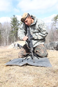 Cpl. Rudy Santos Santos of Comando Especial Antiterrorista of the El Salvadoran Army operates an M249 light machine gun during the New Hampshire National Guard's 2017 Best Warrior competition at New Castle April 9. This year marked the first time two Soldiers from El Salvador, New Hampshire’s State Military partner, competed in the three-day competition alongside 22 New Hampshire Guardsmen, showing off skills in marksmanship, first aid, physical training and land navigation among others. 