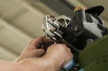 A member of the 54th Helicopter Squadron inspects a gear box at Minot Air Force Base, N.D., May 2, 2017. The unit provides convoy support, missile complex security and maintains aircrew flight proficiency. (U.S. Air Force photo/Airman 1st Class Jonathan McElderry)