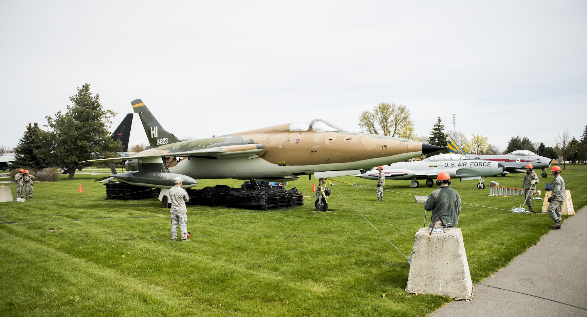 Fairchild Airmen airlift a historic F-105D Thunderchief display to make repairs to the footings May 1, 2017, at Fairchild Air Force Base, Washington. This aircraft has been at the Fairchild Heritage Park since 1981, and was dedicated on behalf of Washington native, Capt. James Shively, a F-105 pilot and prisoner of war in Vietnam. (U.S. Air Force photo/ Airman 1st Class Sean Campbell)