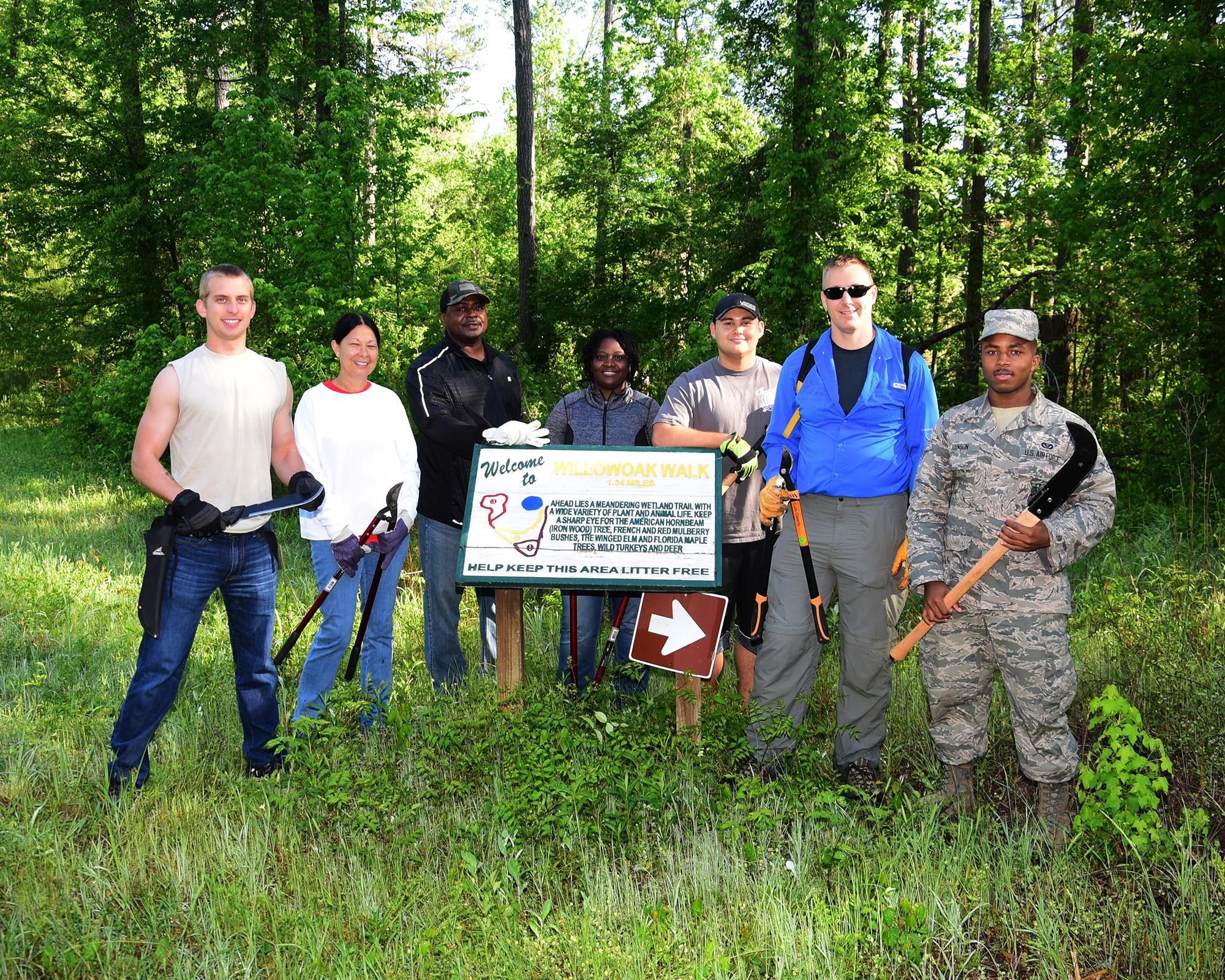 Team BLAZE members clean the nature trails April 25, 2017, at Columbus Air Force Base, Mississippi. Community members picked up litter and trimmed the trails in honor of Earth Day. (U.S. Air Force photo by Elizabeth Owens)
