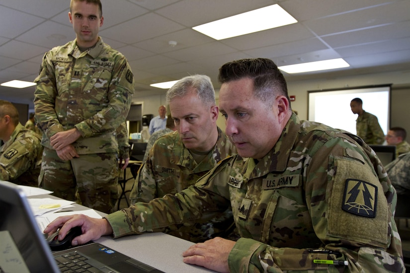 Sgt. Charles Apperti, a U.S. Army Reserve information technology specialist assigned to the Army Reserve Cyber Operations Group, Western Cyber Protection Center out of Camp Parks, Ca., shows Col. Michael D. Smith, commander for the Army Reserve Cyber Operations Group out of Adelphi, Md., his work during Cyber Shield 17 at Camp Williams, Utah, May 2, 2017. Cyber Shield is a National Guard exercise, in cooperation with U.S. Army Reserve, that provides Soldiers, Airmen and civilians from over 44 states and territories the opportunity to test their skills in response to cyber-incidents in a multi-service environment. (U.S. Army Reserve photo by Sgt. Stephanie Ramirez)
