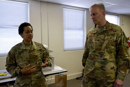 Maj. Ambyr Leidig, a U.S. Army Reserve Soldier assigned to the Army Reserve Cyber Operations Group, Western Cyber Protection Center out of Camp Parks, Ca., briefs Col. Michael D. Smith, commander for the Army Reserve Cyber Operations Group out of Adelphi, Md., during Cyber Shield 17 at Camp Williams, Utah, May 2, 2017. Cyber Shield is a National Guard exercise, in cooperation with U.S. Army Reserve, that provides Soldiers, Airmen and civilians from over 44 states and territories the opportunity to test their skills in response to cyber-incidents in a multi-service environment. (U.S. Army Reserve photo by Sgt. Stephanie Ramirez)