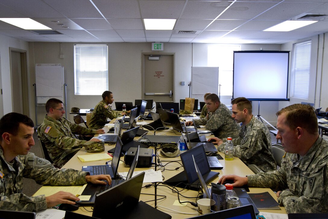 A group of U.S. Army Reserve and National Guard cyber Soldiers work together to defend their network during Cyber Shield 17 at Camp Williams, Utah, May 2, 2017. Cyber Shield is a National Guard exercise, in cooperation with U.S. Army Reserve, that provides Soldiers, Airmen and civilians from over 44 states and territories the opportunity to test their skills in response to cyber-incidents in a multi-service environment. (U.S. Army Reserve photo by Sgt. Stephanie Ramirez)