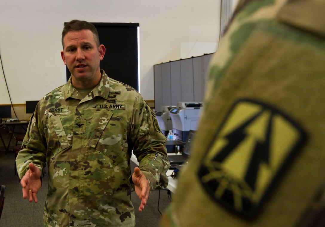 Col. John Zierdt, the U.S. Army Reserve Cyber Shield Exercise leader of the 75th Training Command, Gulf Training Division, out of Birmingham, Al., explains to a Soldier the mission of the White Team during Cyber Shield 17 at Camp Williams, Utah, May 2, 2017. Cyber Shield is a National Guard exercise, in cooperation with U.S. Army Reserve, that provides Soldiers, Airmen and civilians from over 44 states and territories the opportunity to test their skills in response to cyber-incidents in a multi-service environment. (U.S. Army Reserve photo by Sgt. Stephanie Ramirez)