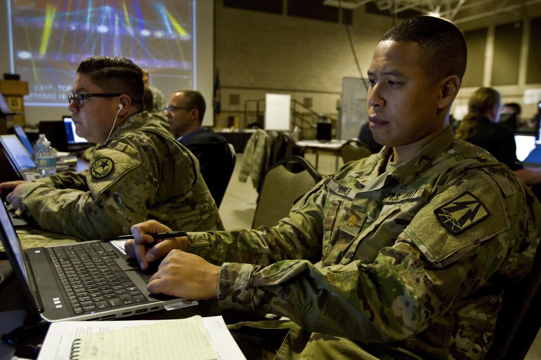 Maj. Lavon Hooker, a U.S. Army Reserve cyber planner assigned to the 335th Signal Command (Theater) out of East Point, Ga., protects the network during Cyber Shield 17 at Camp Williams, Utah, May 2, 2017. Cyber Shield is a National Guard exercise, in cooperation with U.S. Army Reserve, that provides Soldiers, Airmen and civilians from over 44 states and territories the opportunity to test their skills in response to cyber-incidents in a multi-service environment. (U.S. Army Reserve photo by Sgt. Stephanie Ramirez)