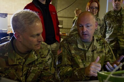 Chief Warrant Officer 3 Richard Tillery, a U.S. Army Reserve senior forensics officer assigned to the Army Reserve Cyber Operations Group (ARCOG), Western Cyber Protection Center out of Camp Parks, Ca., explains his mission to Col. Michael D. Smith, commander for the ARCOG out of Adelphi, Md., during Cyber Shield 17 at Camp Williams, Utah, May 2, 2017. Cyber Shield is a National Guard exercise, in cooperation with U.S. Army Reserve, that provides Soldiers, Airmen and civilians from over 44 states and territories the opportunity to test their skills in response to cyber-incidents in a multi-service environment. (U.S. Army Reserve photo by Sgt. Stephanie Ramirez)