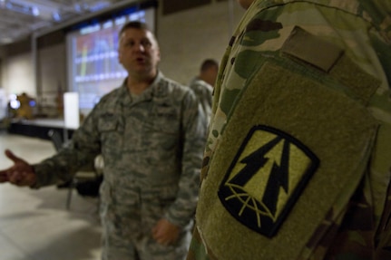 Maj. Michael Ehrstein, Air National Guard cyber space information team chief for the 177th Information Aggressor Squadron out of McConnell Air force Base, Kansas and the Cyber Shield 17 Red Team Lead briefs a Soldier during CS-17 at Camp Williams, Utah, May 2, 2017. Cyber Shield is a National Guard exercise, in cooperation with U.S. Army Reserve, that provides Soldiers, Airmen and civilians from over 44 states and territories the opportunity to test their skills in response to cyber-incidents in a multi-service environment. (U.S. Army Reserve photo by Sgt. Stephanie Ramirez)