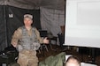Capt. Robert Reynolds, an observer controller/trainer in 1st Brigade, Great Lakes Training Division, 75th Training Brigade, explains the course of action development step of the Military Decision Making Process to members of the 419th Combat Service Support Battalion, headquartered in Tustin, California.
