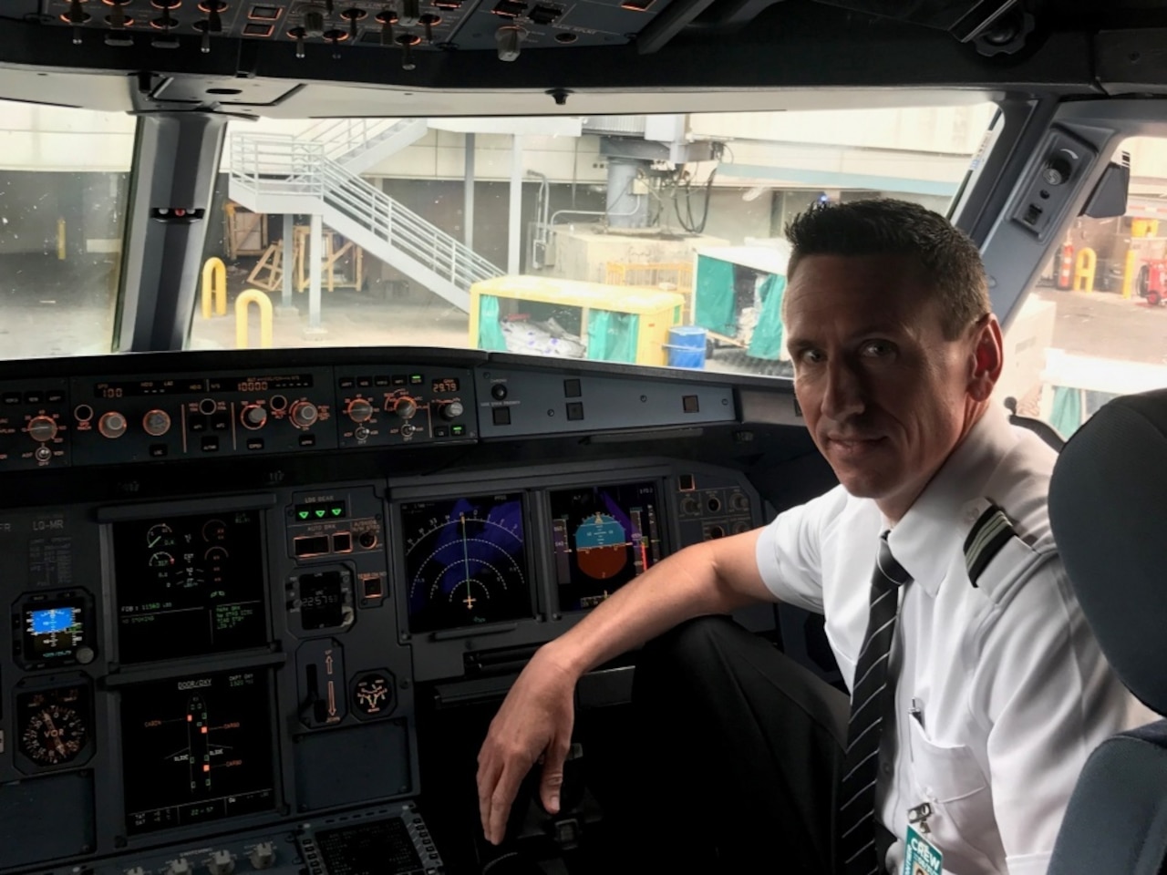Airline pilot Ryan Scofield, pictured here in his cockpit, April 28, 2017, has flown for a commercial airline carrier for 12 years. When he's not in an Airbus A320, he’s piloting a C-130H Hercules aircraft for the Wyoming Air National Guard's 187th Airlift Squadron based in Cheyenne. Air Force Lt. Col. Scofield is also a Modular Airborne Fire Fighting System instructor pilot for the unit. Air Force photo by Master Sgt. Daniel Butterfield