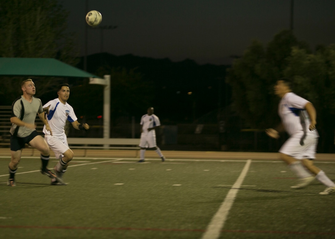 Marines from the Headquarters Battalion and the Marine Corps Communication-Electronics School teams, run for the ball during an intramural soccer game at Felix Field aboard Marine Corps Air Ground Combat Center, Twentynine Palms, Calif., May 1, 2017. Marine Corps Community Services, in partnership with Semper Fit, hosts an intramural soccer league for units aboard the installation. HQBN came out victorious with a score of 3-1. (U.S. Marine Corps photo by Cpl. Medina Ayala-Lo)