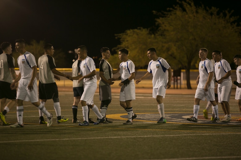 Marines from the Headquarters Battalion and the Marine Corps Communication-Electronics School teams, congratulate each other following an intramural soccer game at Felix Field aboard Marine Corps Air Ground Combat Center, Twentynine Palms, Calif., May 1, 2017. Marine Corps Community Services, in partnership with Semper Fit, hosts an intramural soccer league for units aboard the installation. HQBN came out victorious with a score of 3-1. (U.S. Marine Corps photo by Cpl. Medina Ayala-Lo)