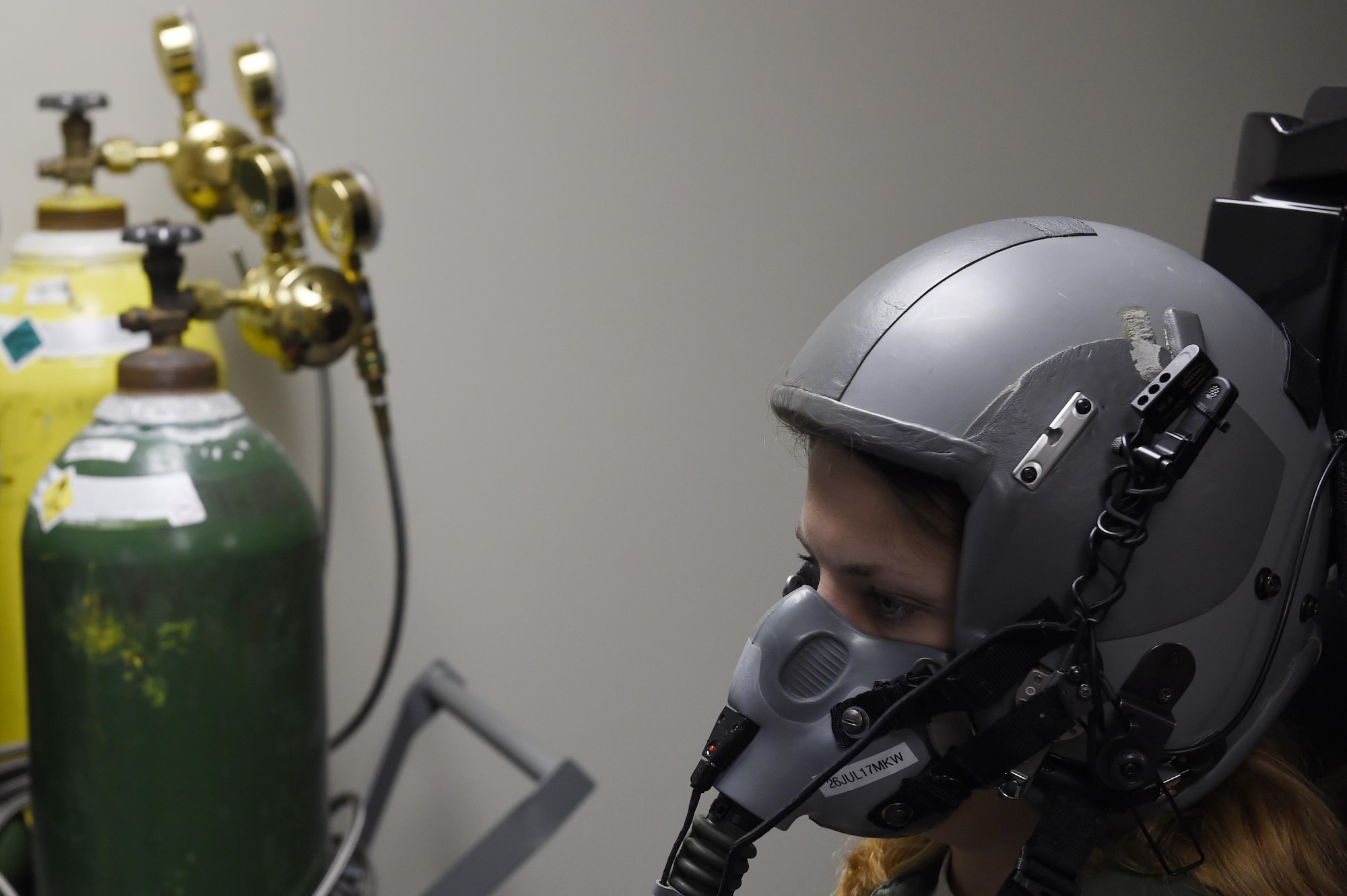 Staff Sgt. Katherine Stanton, 15th Airlift Squadron loadmaster, completes one-on-one hypoxia training in the Reduced Oxygen Breathing Device and Hypoxia Familiarization Trainer. For the training, Airmen fly a C-17 flight task simulation as the ROBD precisely mixes nitrogen and reduced oxygen to equivalent oxygen concentrations at higher altitudes. This allows Airmen to see how hypoxia affects their motor skills and to experience their symptoms in a low risk environment. 