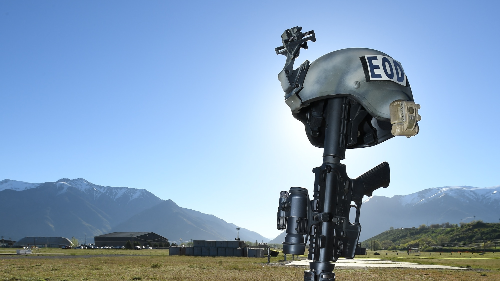 A battlefield cross is on display May 5 at Hill Air Force Base, Utah, during a mud run hosted by the 775th Explosive Ordnance Disposal Flight. The mud run was part of National Explosive Ordnance Disposal Day. The purpose of EOD Day is to remember those who have given the ultimate sacrifice operating as EOD technicians across the Department of Defense. (U.S. Air Force/R. Nial Bradshaw)