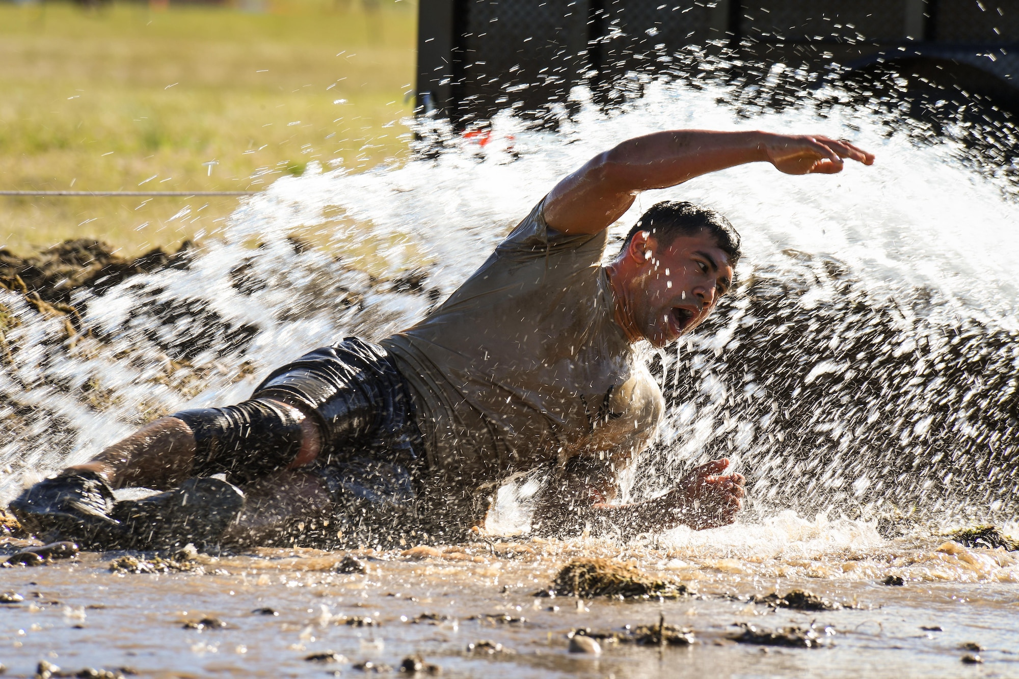 A participant navigates an obstacle May 5 at Hill Air Force Base, Utah, during a mud run hosted by the 775th Explosive Ordnance Disposal Flight. The mud run was part of National Explosive Ordnance Disposal Day. The purpose of EOD Day is to remember those who have given the ultimate sacrifice operating as EOD technicians across the Department of Defense. (U.S. Air Force/R. Nial Bradshaw)