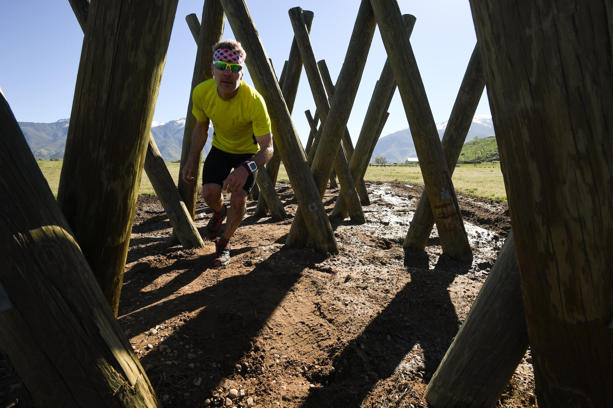 Randy Thomas, 309th Component Maintenance Group, navigates an obstacle May 5 at Hill Air Force Base, Utah, during a mud run hosted by the 775th Explosive Ordnance Disposal Flight. The mud run was part of National Explosive Ordnance Disposal Day, a day to remember EOD technicians who have paid the ultimate sacrifice. There have been 133 EOD technicians killed while performing their craft since 2001, 20 of those being Air Force and four from Hill AFB. (U.S. Air Force/R. Nial Bradshaw)