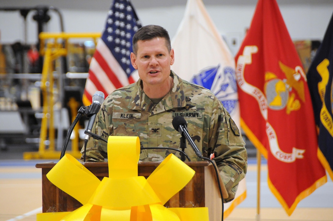 Col. Martin F. Klein, commander of U.S. Army Support Activity, Fort Dix, and deputy commander of Joint Base McGuire-Dix-Lakehurst, New Jersey, delivers remarks during the Col. Jack H. Griffith Jr. Memorial Field House re-opening ceremony May 5 following a 5-month, $750,000 transformation. In addition to receiving a new gym floor and running track, the field house now features energy-efficient lighting and is compliant with the Americans with Disabilities Act. Col. Griffith served as Fort Dix chief of staff from March 1984 until his death from cancer in December 1986. He was commissioned as an Infantry officer through the Reserve Officers’ Training Corps at the University of Virginia, and was a graduate of the Army War College. He served two tours of duty in Vietnam where he was wounded in combat, and served in many other assignments around the world during his 26-year career.