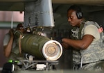 U.S. Air Force Staff Sgt. Terry White, 51st Maintenance Group weapons crew team member, secures munitions on an A-10 Thunderbolt II during Exercise Beverly Herd 17-2 at Osan Air Base, Republic of Korea, May 4, 2017. The no-notice exercise challenged the tradition of planning exercises weeks or months in advance, allowing wing leadership a view of how personnel would respond in real-world situations. 