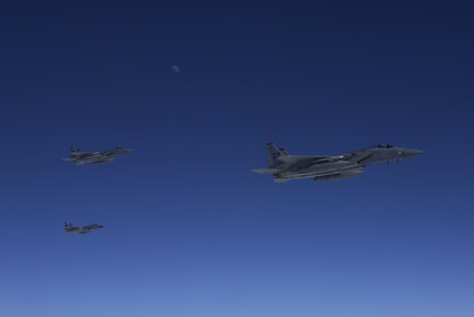 Three U.S. Air Force F-15C Eagles stage on the left side of a KC-10 Extender from the 9th Air Refueling Squadron based out of Travis Air Force Base, Calif., to refuel in-flight during exercise Northern Edge 2017, May 4, 2017. NE17 is Alaska’s premier joint training exercise designed to practice operations, techniques and procedures, as well as enhance interoperability among the services.
