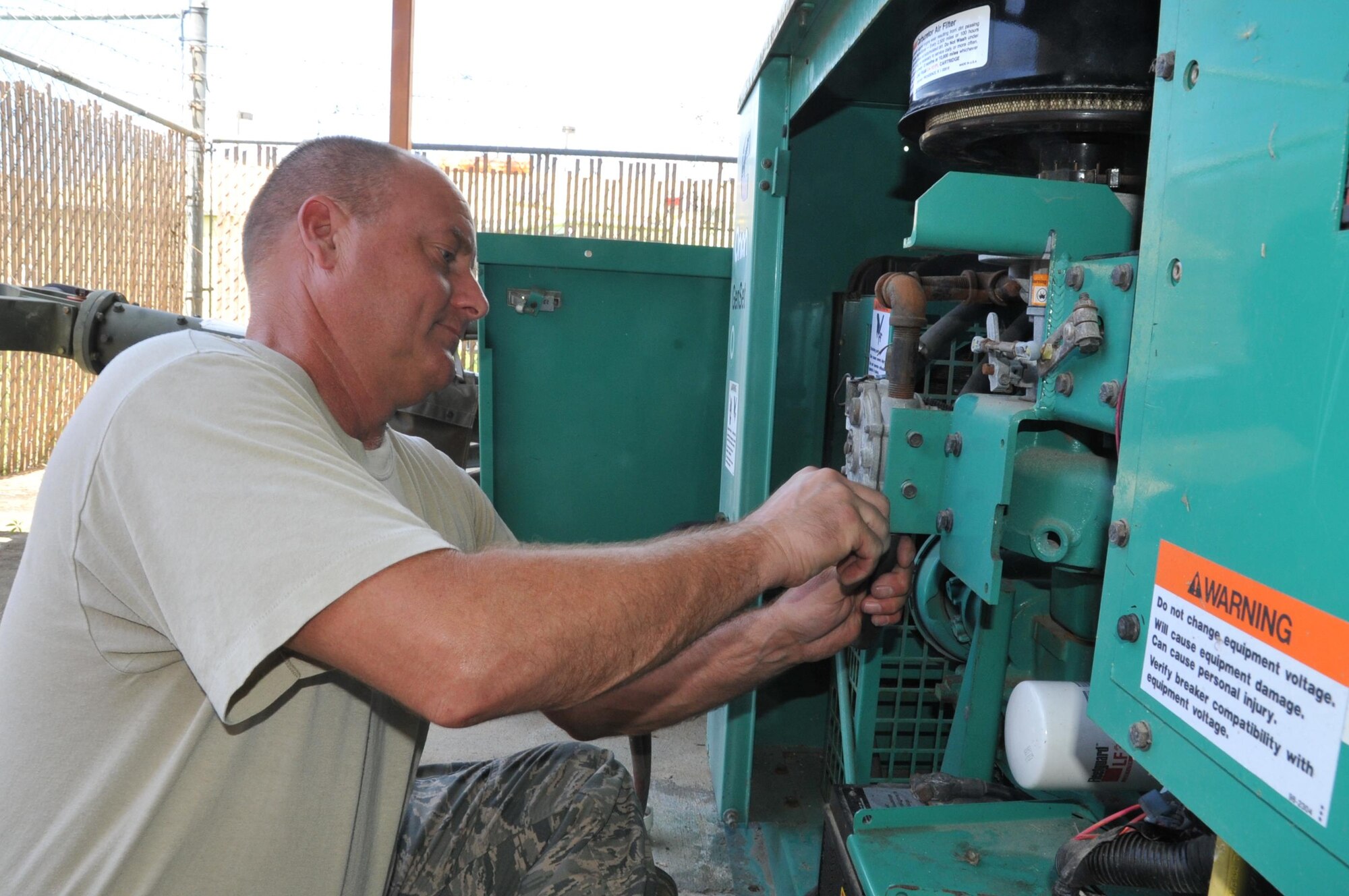 Technical Sgt. David Pelegrin, 919th Special Operations Civil Engineering Squadron power production manager, performs routine maintenance on a building generator May 2, 2017 for the 53rd Weather Reconnaissance Squadron, Detachment 1 located at Henry E. Rohlsen Airport in St. Croix, U.S. Virgin Islands. The repairs and improvements were completed by Members of the 919th Special Operations Civil Engineering Squadron during the annual "roll-out" for the upcoming hurricane season, April 30-May 10. (U.S. Air Force Photo//Master Sgt. Jessica Kendziorek)