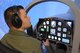 U.S. Air Force Tech. Sgt. Mike, Enlisted Pilot Initial Class student, operates the controls of a T-6 Texan II aircraft simulator, May 4, 2017 at Joint Base San Antonio-Randolph. Mike is assigned to Undergraduate Remotely Piloted Training Class 17-10 with the 558th Flying Training Squadron, and is one of the first three enlisted Airmen to graduate from the course, making him on of the service’s first enlisted pilots since 1961. (U.S. Air Force photo by Joel Martinez)