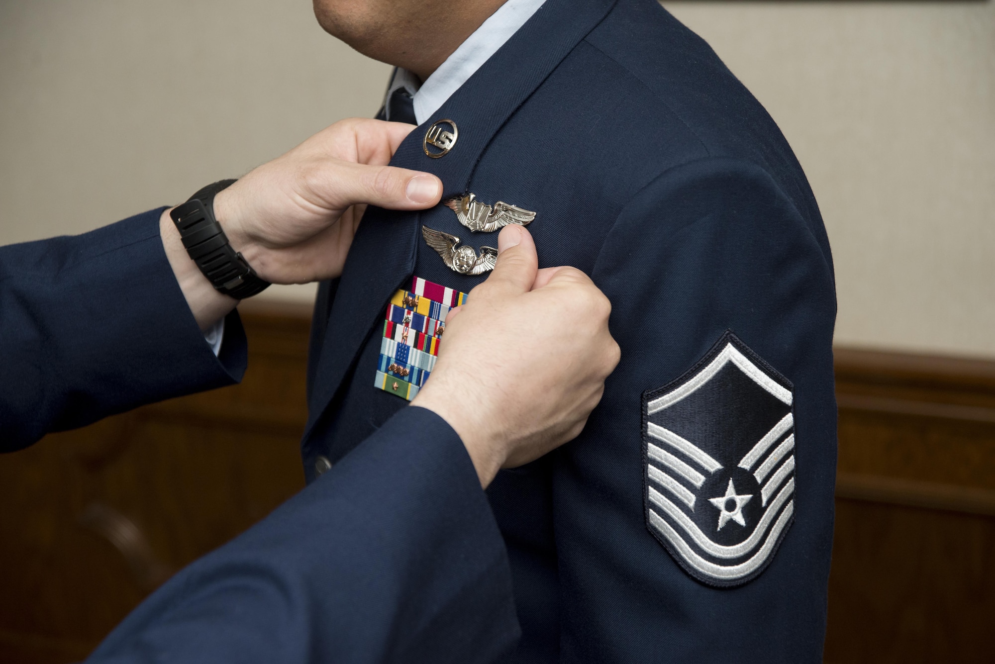 U.S. Air Force Master Sgt. Alex, Enlisted Pilot Initial Class student, has his wings pinned on during graduation from the 558th Flying Training Squadron's Remotely Piloted Aircraft Fundamentals Course May 5, 2017, at Joint Base San Antonio-Randolph, Texas.  Alex is one of the first three enlisted Airmen to graduate from the course, making him one of the service’s first enlisted pilots since 1961. (U.S. Air Force Photo by Melissa Peterson)